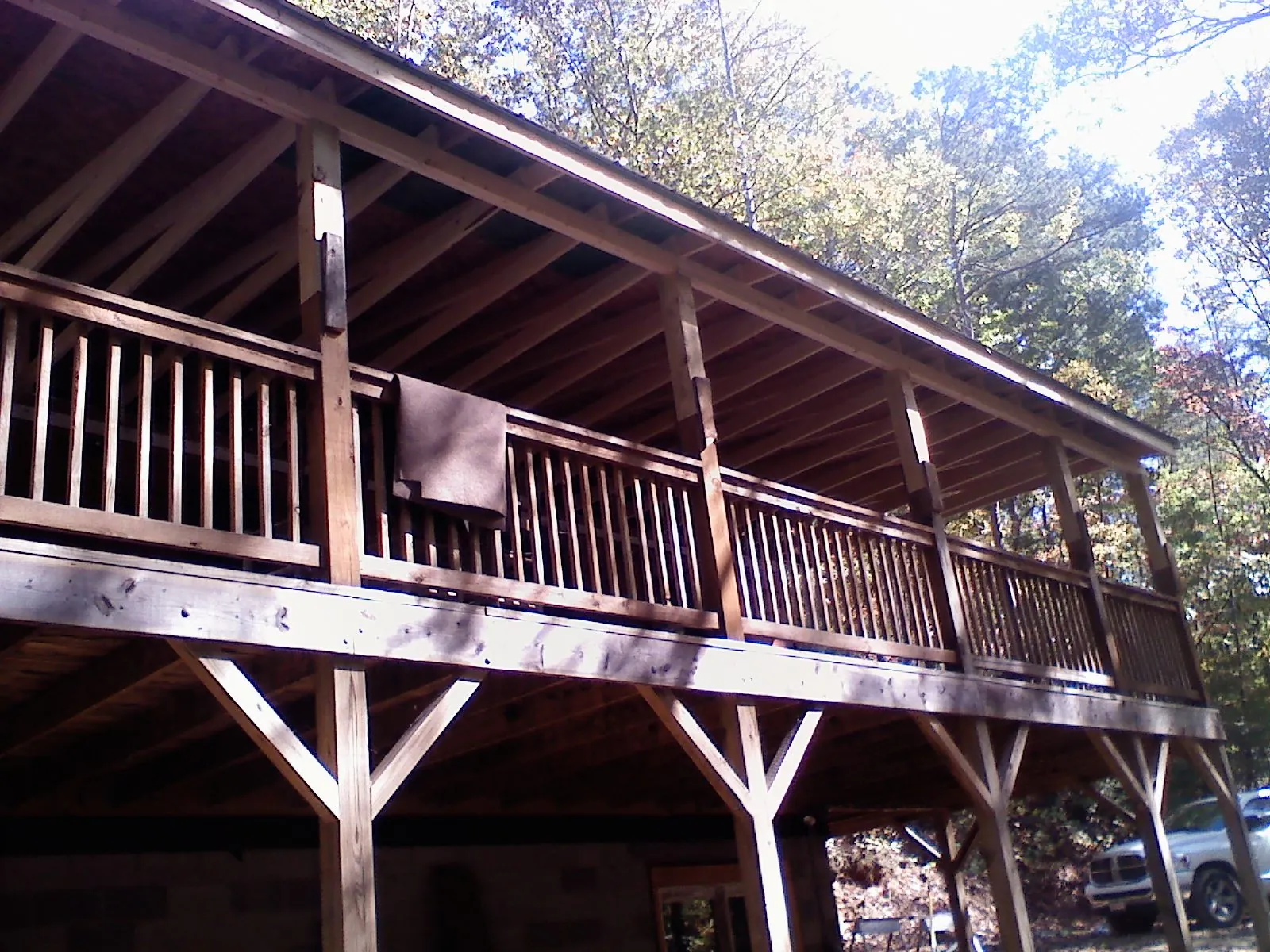 Timber framing under a new elevated porch and deck — Roof Leak Repair in Gilmanton by Roofing Brothers